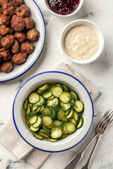 lightly salted cucumbers and meatballs