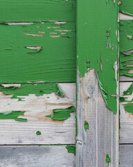 close-up material texture of peeling green paint on wooden boards