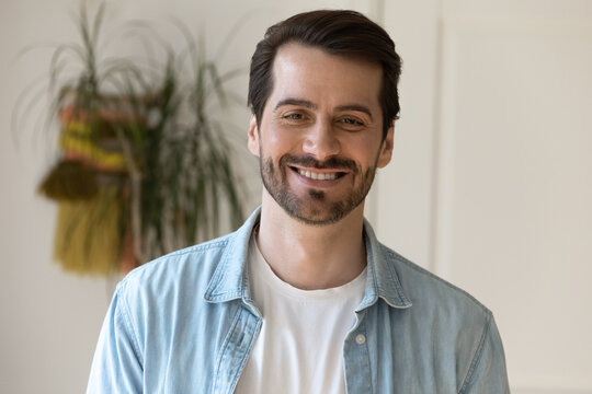 Profile picture of smiling young Caucasian man look at camera feel optimistic. Headshot close up portrait of happy millennial male show white healthy teeth. Renter or tenant satisfied with service.
