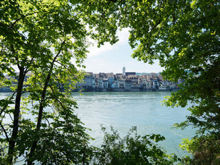 Fototapeta na wymiar View of the historic and medieval town of Rheinfelden in Switzerland from the hiking trail along the Rhine in Rheinfelden in Germany