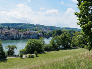 View of the historic and medieval town of Rheinfelden in Switzerland from the hiking trail along the Rhine in Rheinfelden in Germany