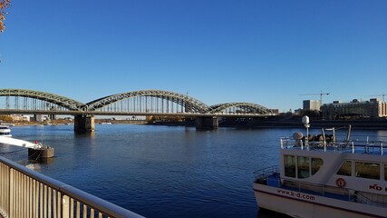 Fototapeta na wymiar Cologne bridge over river main blue water and good weather