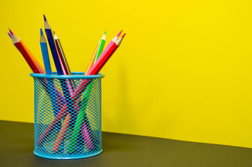 colored pencils in pencil holder