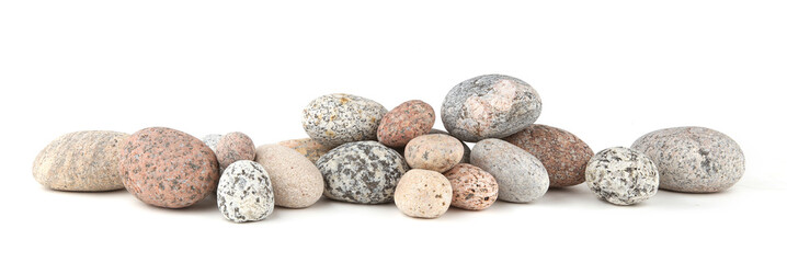Sea smooth oval pebbles isolated on white background. Heap of stacked round pebbles.