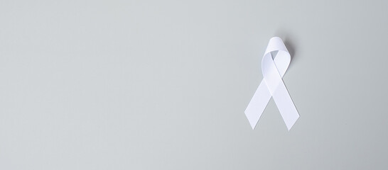 November Lung Cancer Awareness month, democracy and international peace day. white Ribbon on grey...