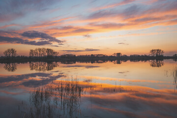 Reflection of colourful clouds in the lake