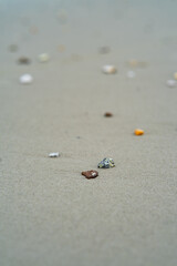 unique stones lie on a sandy background, selective focus with blur.
