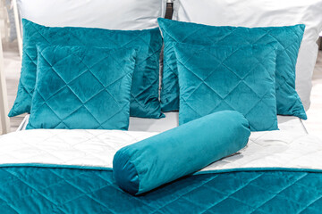 Blue Plush Pillows in Bed