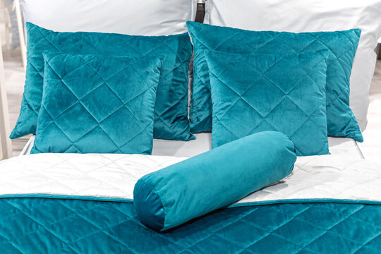 Blue Plush Pillows In Bed