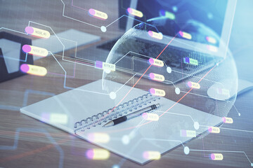 Multi exposure of table with computer and world map hologram. International data network concept.