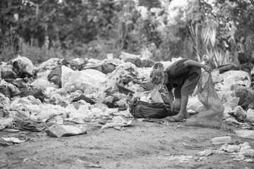 Child labor. Children are forced to work on rubbish. Poor children collect garbage. Poverty,  Violence children and trafficking concept,Anti-child labor, Rights Day on December 10.