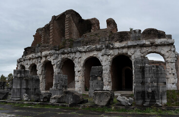Naklejka premium Roman amphitheater, ancient ruins, view of the city of Santa Maria Capua Vetere. Italy. Rainy day.