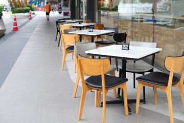 Chair and dining table Prepared in the area beside the restaurant For serving Walkway area