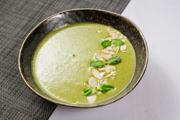 Green spinach cream soup close up
