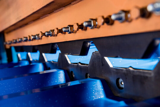 Metal sheet forming machine at the modern metalwork factory.
