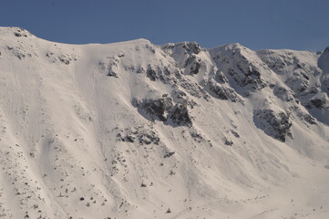 Skiing and snowboarding in the Jasna and Zakopane ski resorts between Poland and Slovakia in the Tatra Mountains