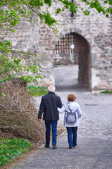 Senior couple on a walk to the Old castle in Hungarian countryside