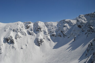 Skiing and snowboarding in the Jasna and Zakopane ski resorts between Poland and Slovakia in the Tatra Mountains