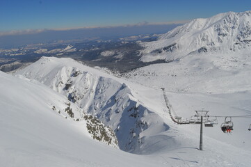 Skiing and snowboarding in the Jasna and Zakopane ski resorts between Poland and Slovakia in the Tatra Mountains