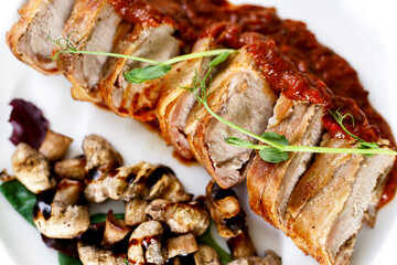 Veal medallions with bacon and mushrooms under adjika