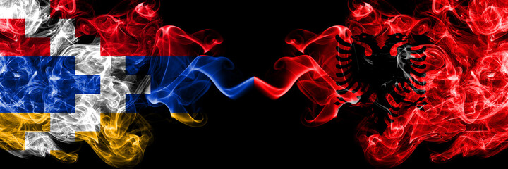 Nagorno-Karabakh, Artsakh vs Albania, Albanian smoky mystic flags placed side by side. Thick colored silky abstract smoke flags