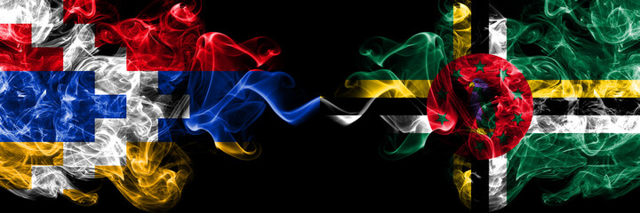 Nagorno-Karabakh, Artsakh vs Dominica smoky mystic flags placed side by side. Thick colored silky abstract smoke flags