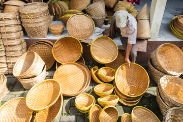 Seller of bamboo handicrafts in traditional markets