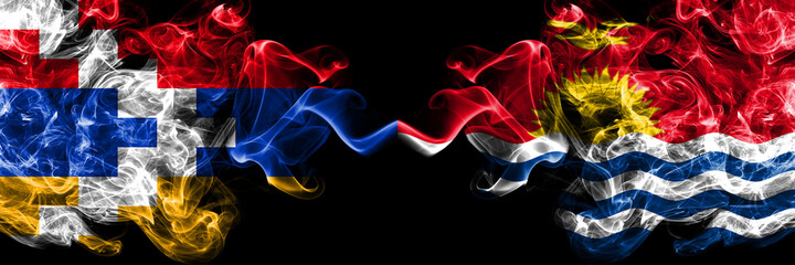Nagorno-Karabakh, Artsakh vs Kiribati smoky mystic flags placed side by side. Thick colored silky abstract smoke flags