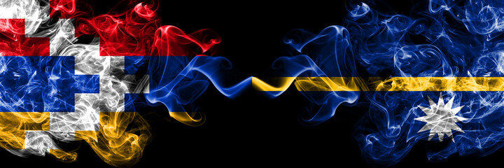Nagorno-Karabakh, Artsakh vs Nauru smoky mystic flags placed side by side. Thick colored silky abstract smoke flags