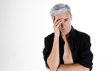 Headache and stress. Young attractive guy. Grey background.