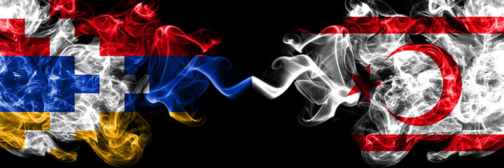 Nagorno-Karabakh, Artsakh vs Northern Cyprus smoky mystic flags placed side by side. Thick colored silky abstract smoke flags