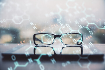 Formulas drawing with glasses on the table background. Concept of science. Double exposure.