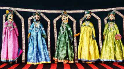 Handmade puppets attached to string, handicraft Jaipur, Kings Rajasthan India. Dolls with men face wearing traditional dress Kurta for plays, dance, Puppet show on Dussehra, Dasara, Diwali festival 