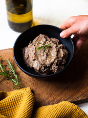 Preparing liver pate. Rustic home cooking in natural light.