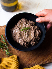 Preparing liver pate. Rustic home cooking in natural light.