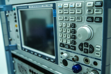 The detail of the electronic measuring equipment with a lot of buttons and a display. 
