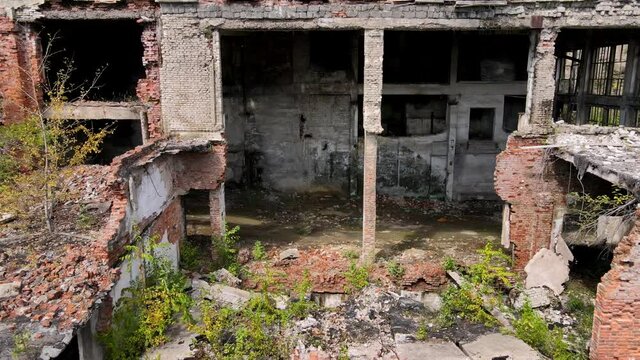 View from above. Khrustalnensky mining and processing plant. The camera pans over the destroyed abandoned buildings of a mining factory in Russia