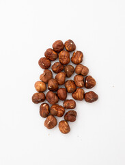 Peeled Hazelnuts on white background