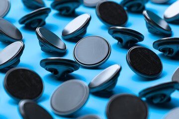 Obraz na płótnie Canvas Black Blank Pin Buttons With Empty Space On Light Blue Background. 3d rendering