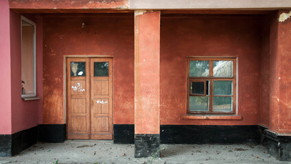 House entrance, doors and window on a terracotta wall background. Quality image for your project