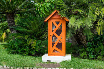 Beaulieu-sur-Mer,  France. 14.07.2020. Small orange house in the city park using for a library...