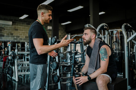 Support from personal trainer in gym