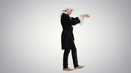 Man dressed like Mozart conducting while walking on gradient bac