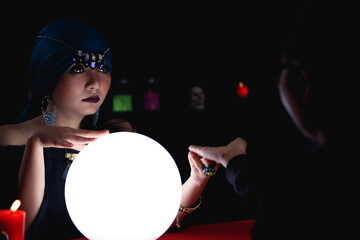 Fortune teller forecast future of her customer.