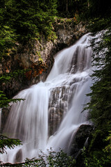 Fototapeta na wymiar Mountain brook waterfall time lapse