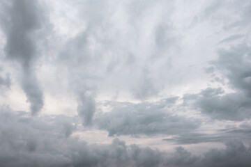 Naklejka na ściany i meble Grey high layered grey epic clouds on sky. Heaven cloudscape air view