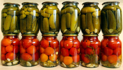 Pickled vegetables. Jars of pickled tomatoes and cucumbers