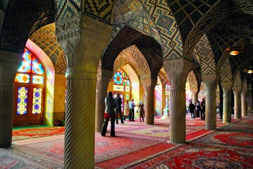 Tourists visit the Nasir al-Mulk Mosque, also known as the Pink Mosque due to the usage of a considerable number of pink-colored tiles. Shiraz Iran.