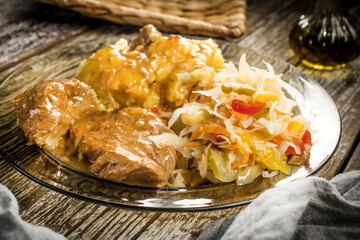 Braised pork in own sauce served with boiled potatoes and salad.