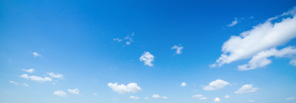 Panoramic blue sky background with white clouds, panoramic bright summer day cloudscape backdrop